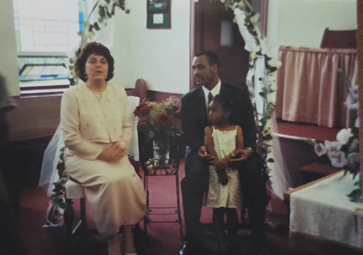 Kayla as a child with family